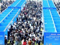 College graduates are attending a job fair in Qingdao, Shandong Province, China, on March 23, 2024. (