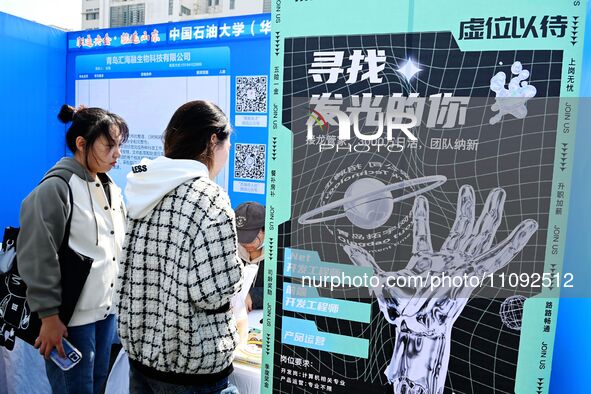 College graduates are attending a job fair in Qingdao, Shandong Province, China, on March 23, 2024. 