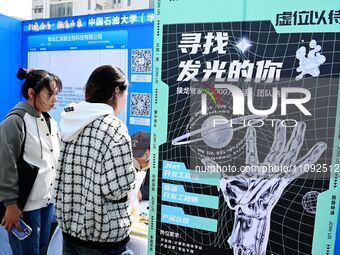 College graduates are attending a job fair in Qingdao, Shandong Province, China, on March 23, 2024. (