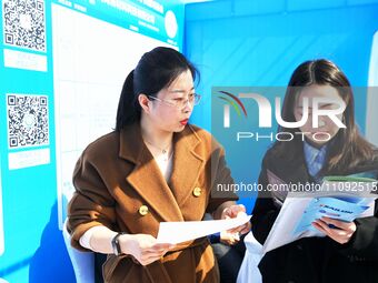 College graduates are attending a job fair in Qingdao, Shandong Province, China, on March 23, 2024. (