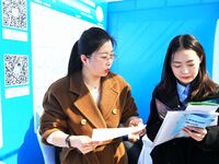 College graduates are attending a job fair in Qingdao, Shandong Province, China, on March 23, 2024. (