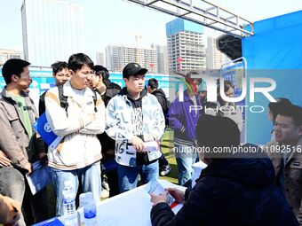 College graduates are attending a job fair in Qingdao, Shandong Province, China, on March 23, 2024. (