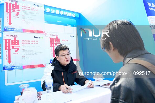 College graduates are attending a job fair in Qingdao, Shandong Province, China, on March 23, 2024. 