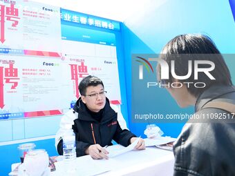 College graduates are attending a job fair in Qingdao, Shandong Province, China, on March 23, 2024. (