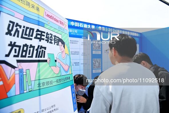 College graduates are attending a job fair in Qingdao, Shandong Province, China, on March 23, 2024. 