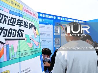 College graduates are attending a job fair in Qingdao, Shandong Province, China, on March 23, 2024. (