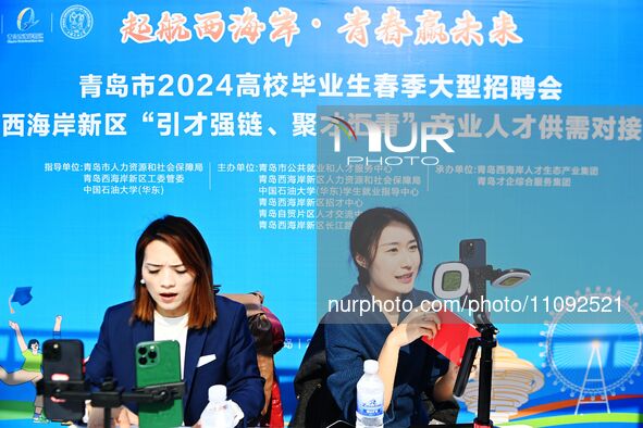 College graduates are attending a job fair in Qingdao, Shandong Province, China, on March 23, 2024. 