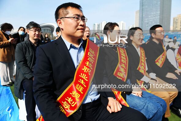 College graduates are attending a job fair in Qingdao, Shandong Province, China, on March 23, 2024. 