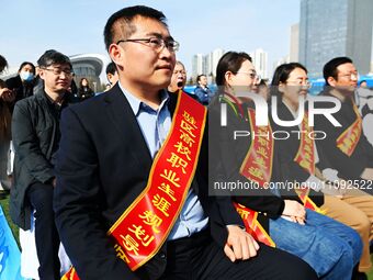 College graduates are attending a job fair in Qingdao, Shandong Province, China, on March 23, 2024. (