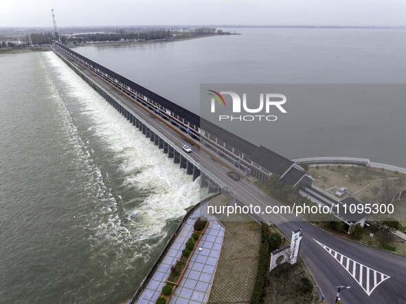 An aerial photo is showing the flood discharge from the 63-hole sluice of the Sanhe Gate of Hongze Lake in Huai'an, China, on March 24, 2024...