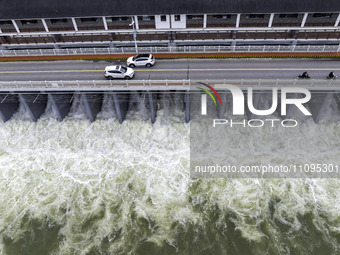 An aerial photo is showing the flood discharge from the 63-hole sluice of the Sanhe Gate of Hongze Lake in Huai'an, China, on March 24, 2024...