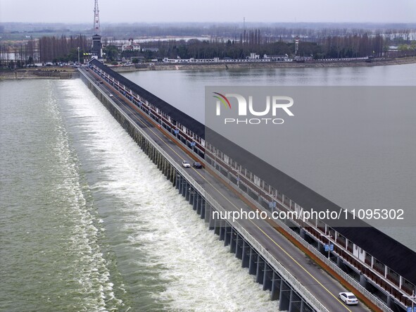 An aerial photo is showing the flood discharge from the 63-hole sluice of the Sanhe Gate of Hongze Lake in Huai'an, China, on March 24, 2024...