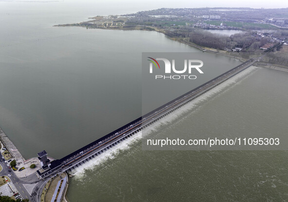 An aerial photo is showing the flood discharge from the 63-hole sluice of the Sanhe Gate of Hongze Lake in Huai'an, China, on March 24, 2024...