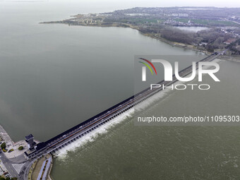 An aerial photo is showing the flood discharge from the 63-hole sluice of the Sanhe Gate of Hongze Lake in Huai'an, China, on March 24, 2024...