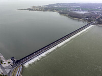 An aerial photo is showing the flood discharge from the 63-hole sluice of the Sanhe Gate of Hongze Lake in Huai'an, China, on March 24, 2024...