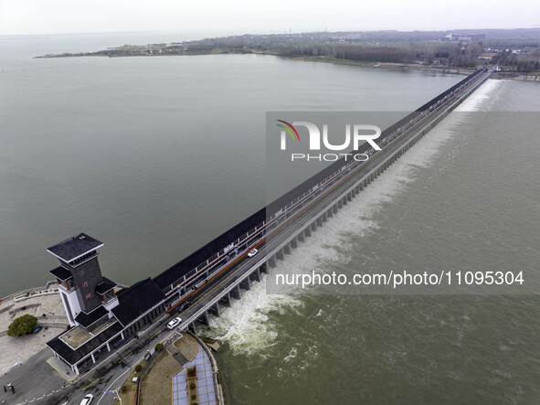 An aerial photo is showing the flood discharge from the 63-hole sluice of the Sanhe Gate of Hongze Lake in Huai'an, China, on March 24, 2024...