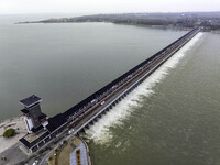 An aerial photo is showing the flood discharge from the 63-hole sluice of the Sanhe Gate of Hongze Lake in Huai'an, China, on March 24, 2024...