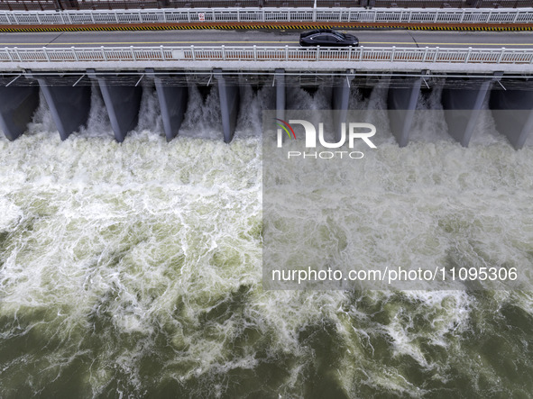 An aerial photo is showing the flood discharge from the 63-hole sluice of the Sanhe Gate of Hongze Lake in Huai'an, China, on March 24, 2024...