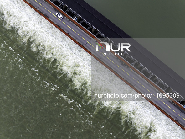 An aerial photo is showing the flood discharge from the 63-hole sluice of the Sanhe Gate of Hongze Lake in Huai'an, China, on March 24, 2024...