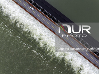 An aerial photo is showing the flood discharge from the 63-hole sluice of the Sanhe Gate of Hongze Lake in Huai'an, China, on March 24, 2024...