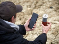 A man is taking a picture of a tear gas canister launched by riot police in the Crem'Arbre woods. After 37 days in the trees, the last three...