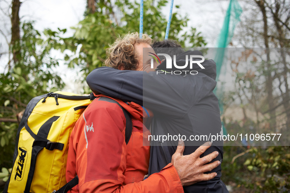 Reva, one of the three 'Ecureuils', is being hugged by a friend. After 37 days in the trees, the last three 'Ecureuils' living in the ZAD (Z...