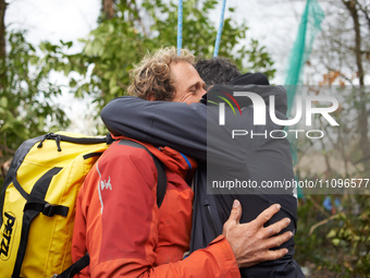 Reva, one of the three 'Ecureuils', is being hugged by a friend. After 37 days in the trees, the last three 'Ecureuils' living in the ZAD (Z...