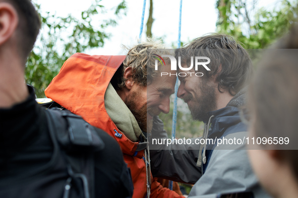 Reva, one of the three 'Ecureuils', is receiving a hug from a friend. After 37 days in the trees, the last three 'Ecureuils' living in the t...