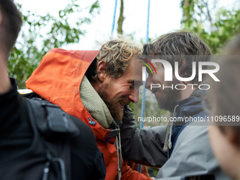 Reva, one of the three 'Ecureuils', is receiving a hug from a friend. After 37 days in the trees, the last three 'Ecureuils' living in the t...