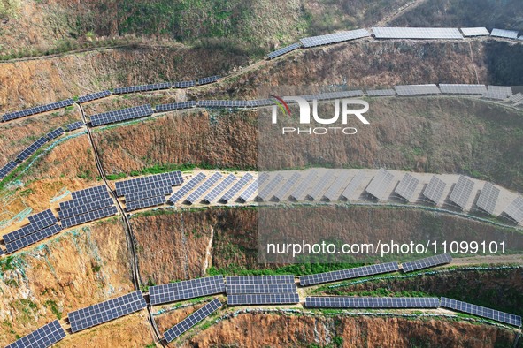 A photovoltaic power generation facility at an abandoned mine is being seen from the air in Hangzhou, Zhejiang Province, China, on March 26,...