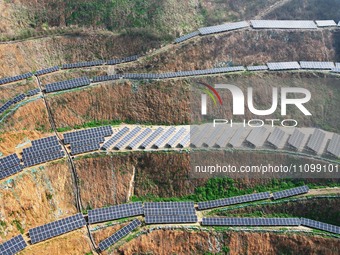 A photovoltaic power generation facility at an abandoned mine is being seen from the air in Hangzhou, Zhejiang Province, China, on March 26,...