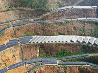 A photovoltaic power generation facility at an abandoned mine is being seen from the air in Hangzhou, Zhejiang Province, China, on March 26,...