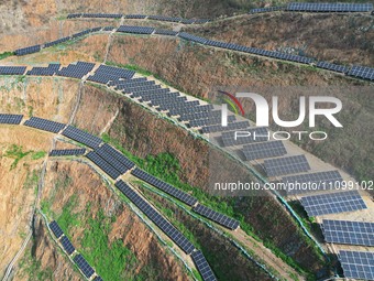 A photovoltaic power generation facility at an abandoned mine is being seen from the air in Hangzhou, Zhejiang Province, China, on March 26,...