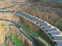 A photovoltaic power generation facility at an abandoned mine is being seen from the air in Hangzhou, Zhejiang Province, China, on March 26,...