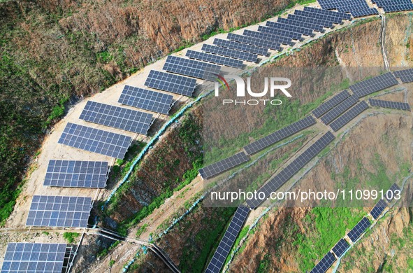 A photovoltaic power generation facility at an abandoned mine is being seen from the air in Hangzhou, Zhejiang Province, China, on March 26,...