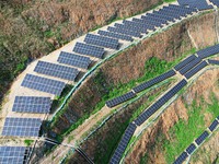 A photovoltaic power generation facility at an abandoned mine is being seen from the air in Hangzhou, Zhejiang Province, China, on March 26,...