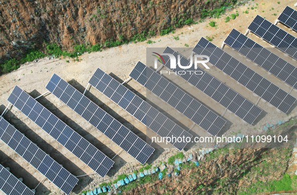 A photovoltaic power generation facility at an abandoned mine is being seen from the air in Hangzhou, Zhejiang Province, China, on March 26,...