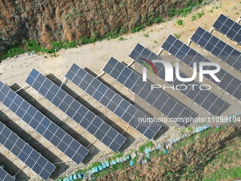 A photovoltaic power generation facility at an abandoned mine is being seen from the air in Hangzhou, Zhejiang Province, China, on March 26,...