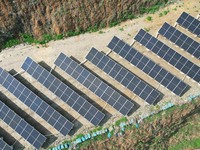 A photovoltaic power generation facility at an abandoned mine is being seen from the air in Hangzhou, Zhejiang Province, China, on March 26,...