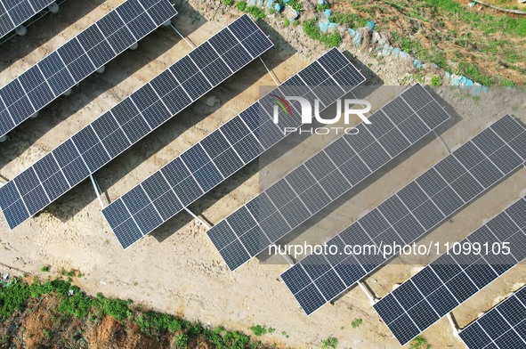 A photovoltaic power generation facility at an abandoned mine is being seen from the air in Hangzhou, Zhejiang Province, China, on March 26,...