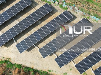 A photovoltaic power generation facility at an abandoned mine is being seen from the air in Hangzhou, Zhejiang Province, China, on March 26,...