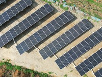 A photovoltaic power generation facility at an abandoned mine is being seen from the air in Hangzhou, Zhejiang Province, China, on March 26,...