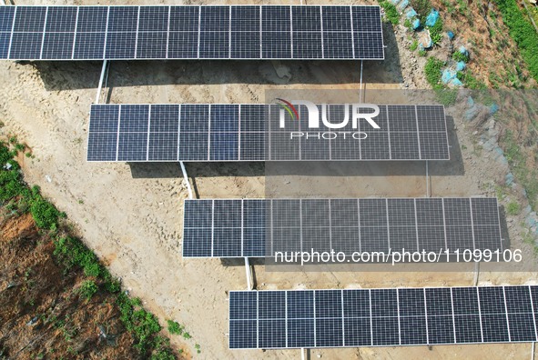 A photovoltaic power generation facility at an abandoned mine is being seen from the air in Hangzhou, Zhejiang Province, China, on March 26,...