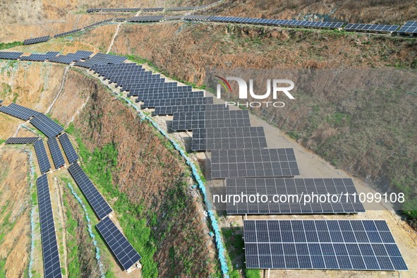 A photovoltaic power generation facility at an abandoned mine is being seen from the air in Hangzhou, Zhejiang Province, China, on March 26,...