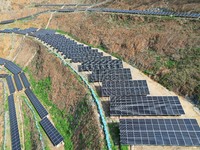 A photovoltaic power generation facility at an abandoned mine is being seen from the air in Hangzhou, Zhejiang Province, China, on March 26,...