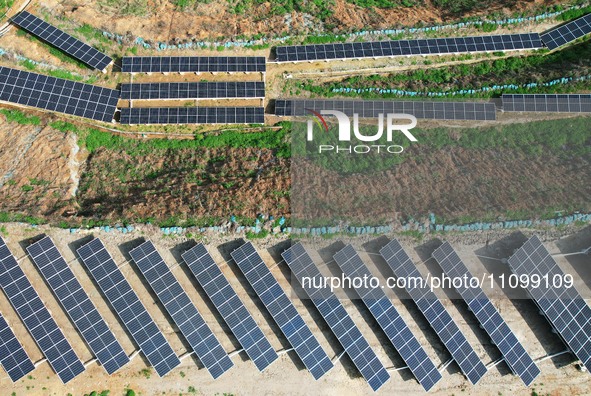 A photovoltaic power generation facility at an abandoned mine is being seen from the air in Hangzhou, Zhejiang Province, China, on March 26,...