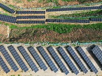 A photovoltaic power generation facility at an abandoned mine is being seen from the air in Hangzhou, Zhejiang Province, China, on March 26,...