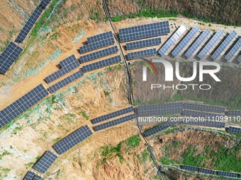 A photovoltaic power generation facility at an abandoned mine is being seen from the air in Hangzhou, Zhejiang Province, China, on March 26,...