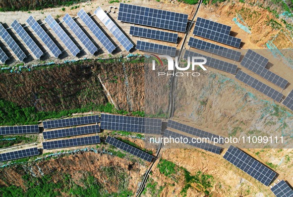 A photovoltaic power generation facility at an abandoned mine is being seen from the air in Hangzhou, Zhejiang Province, China, on March 26,...