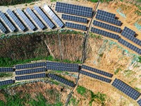 A photovoltaic power generation facility at an abandoned mine is being seen from the air in Hangzhou, Zhejiang Province, China, on March 26,...